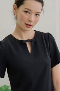 Britney Pleat Hem Bow Dress In Black (XS)
