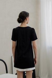 Britney Pleat Hem Bow Dress In Black (XS)