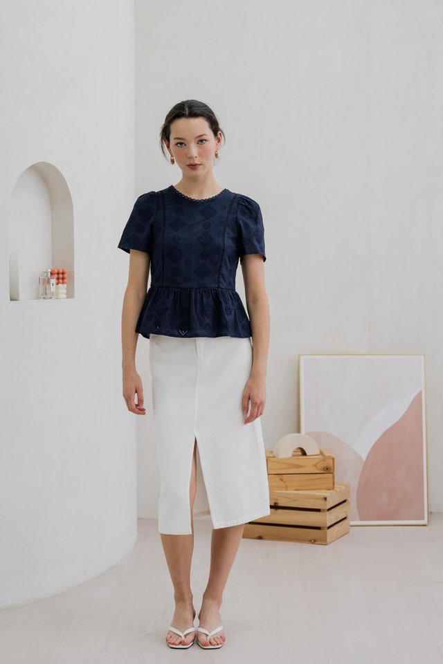 Cove Eyelet Peplum Top In Navy