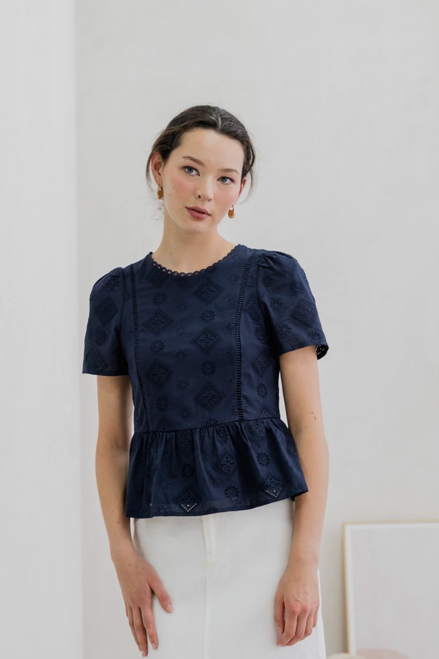 Cove Eyelet Peplum Top In Navy