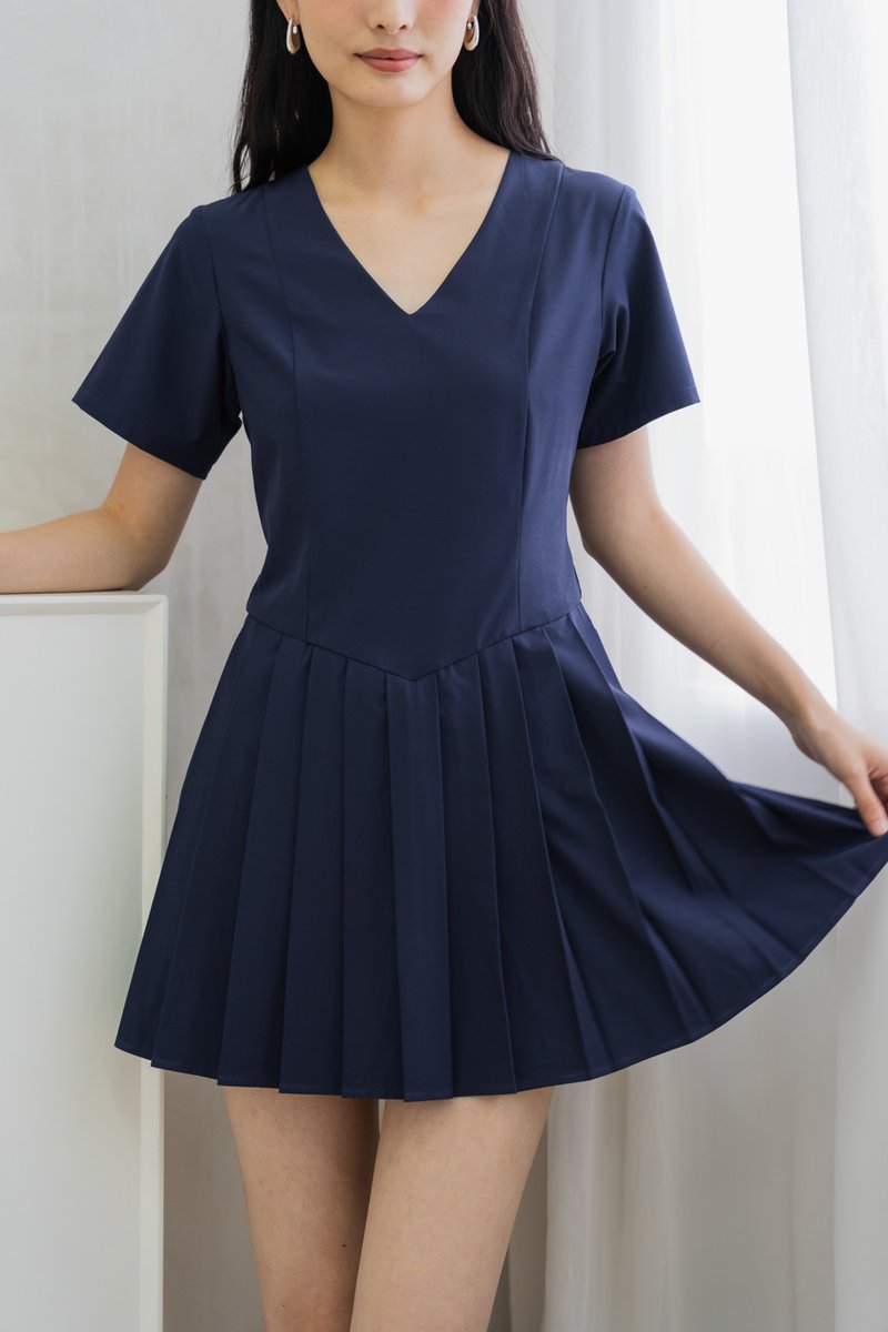 Roslyn Pleated Dress Romper In Navy (XS)