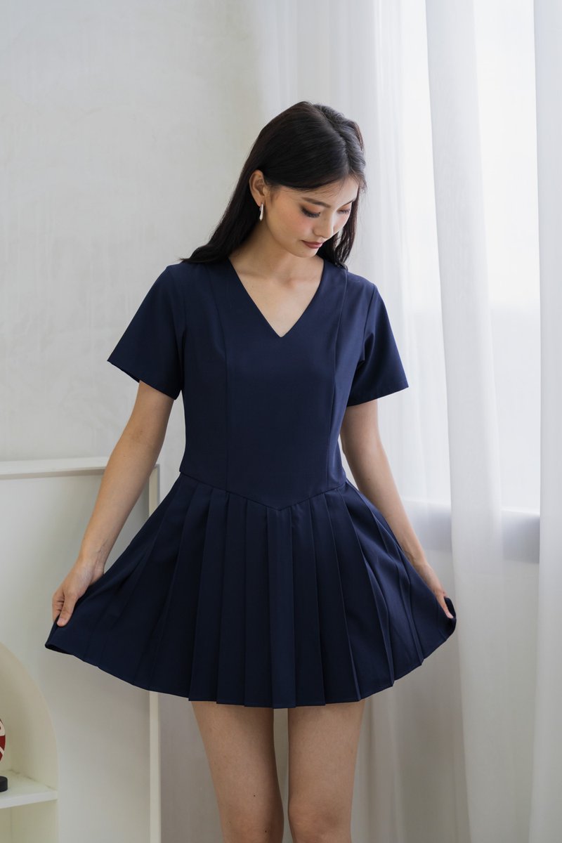 Roslyn Pleated Dress Romper In Navy (XS)