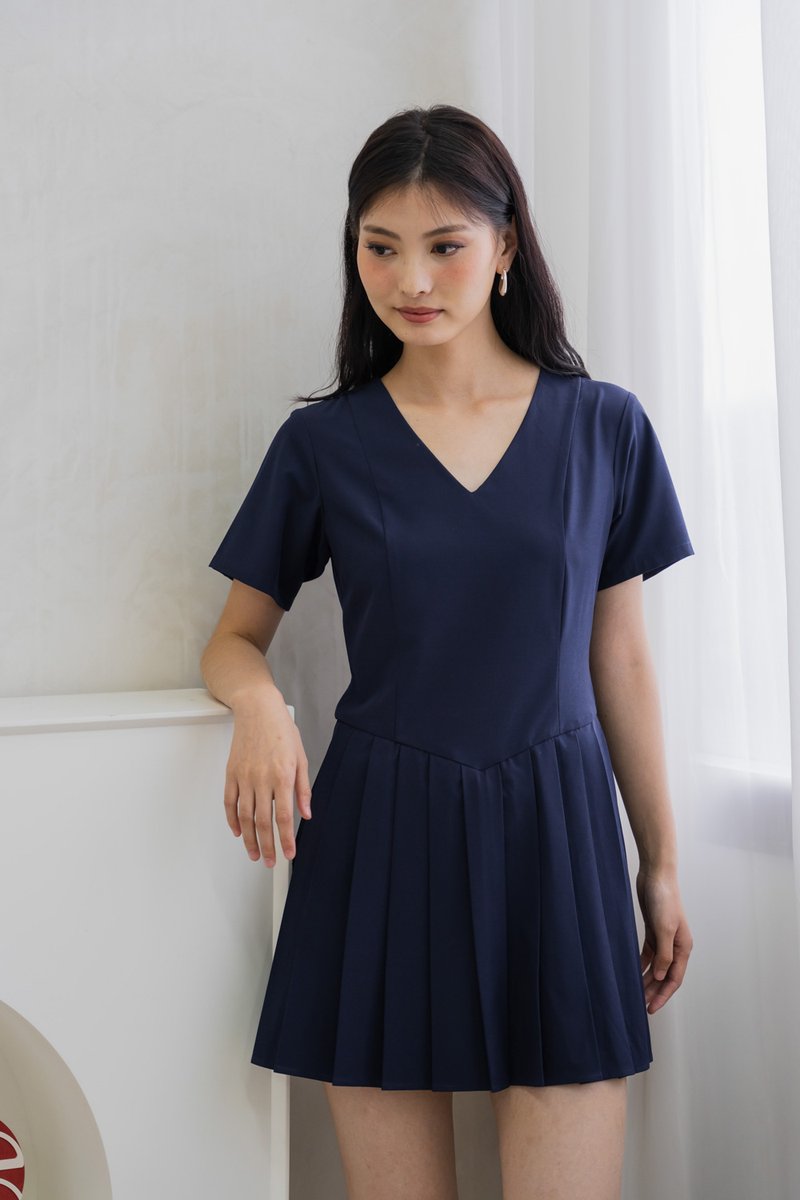 Roslyn Pleated Dress Romper In Navy (XS)