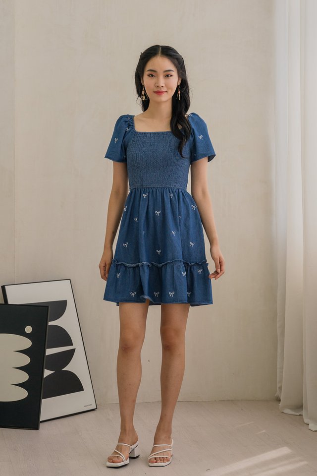 Radiant Smocked Ribbon Denim Dress In Dark Wash