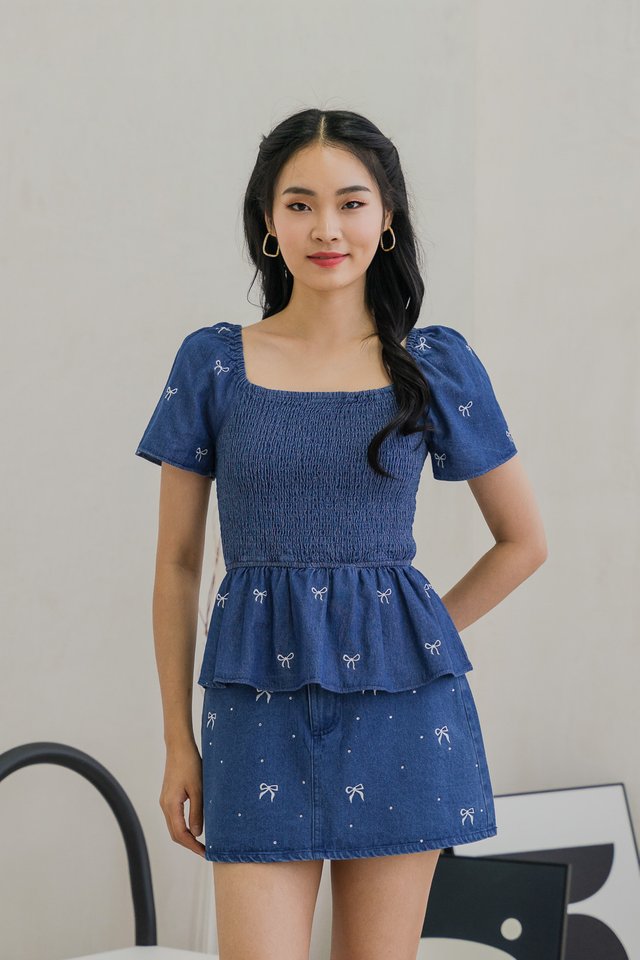 Ricca Smocked Ribbon Denim Top In Dark Wash