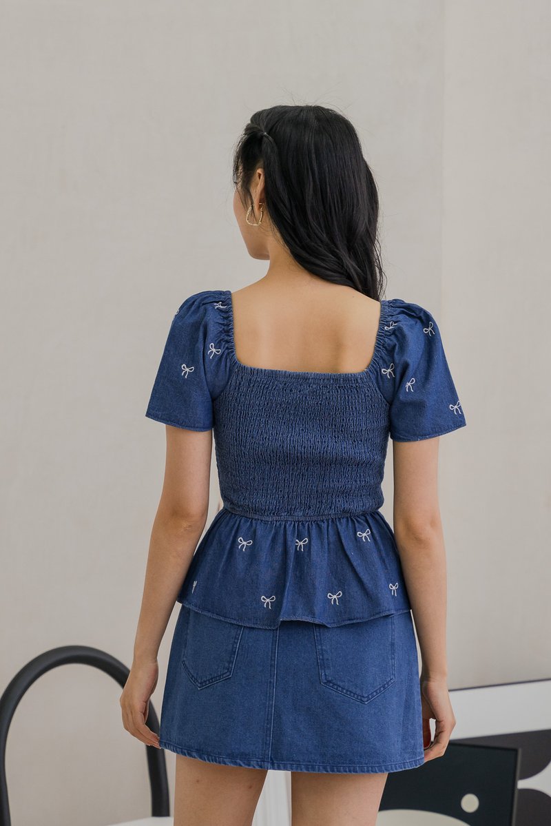 Ricca Smocked Ribbon Denim Top In Dark Wash