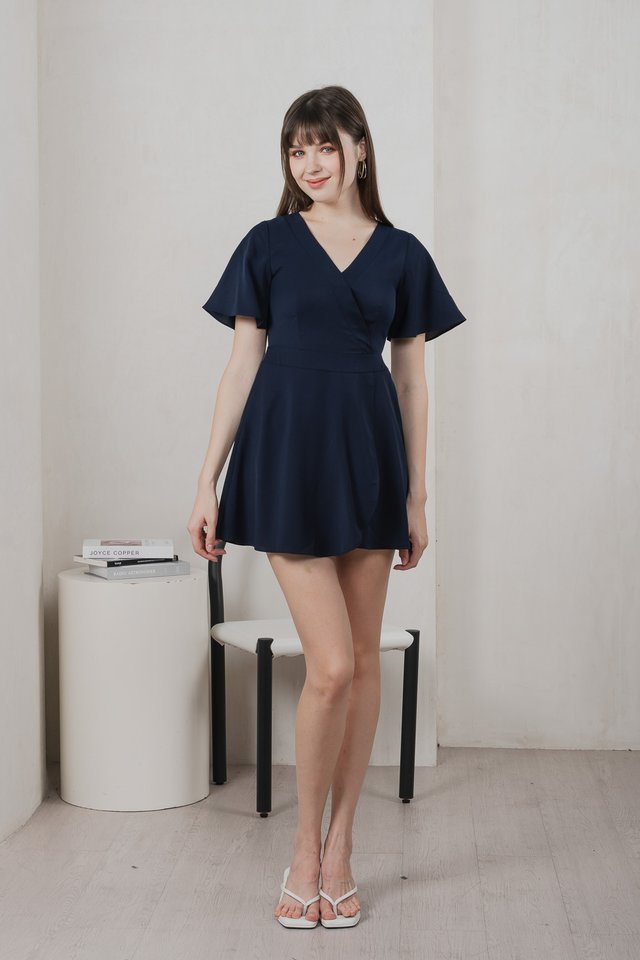 Fika Faux Wrap Dress Romper In Navy