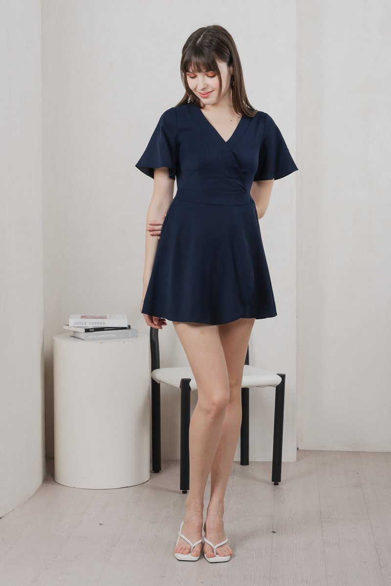 Fika Faux Wrap Dress Romper In Navy (XS)