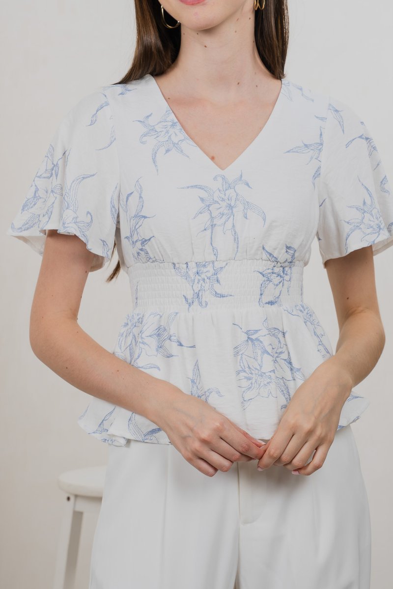 Parisa Printed Smocked Waist Top In Pastel Blue