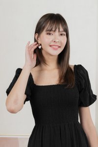 Journey Textured Smocked Midi Dress In Black