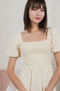 Journey Textured Smocked Midi Dress In Cream
