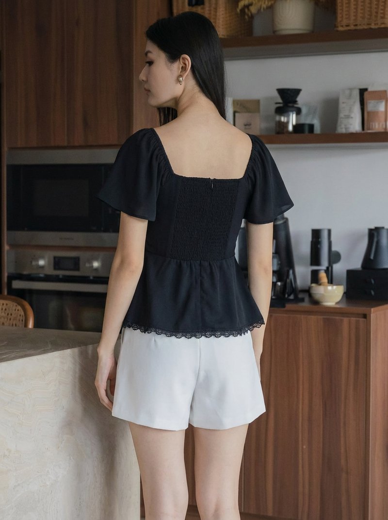 Liz Ruched Crochet Hem Top In Black