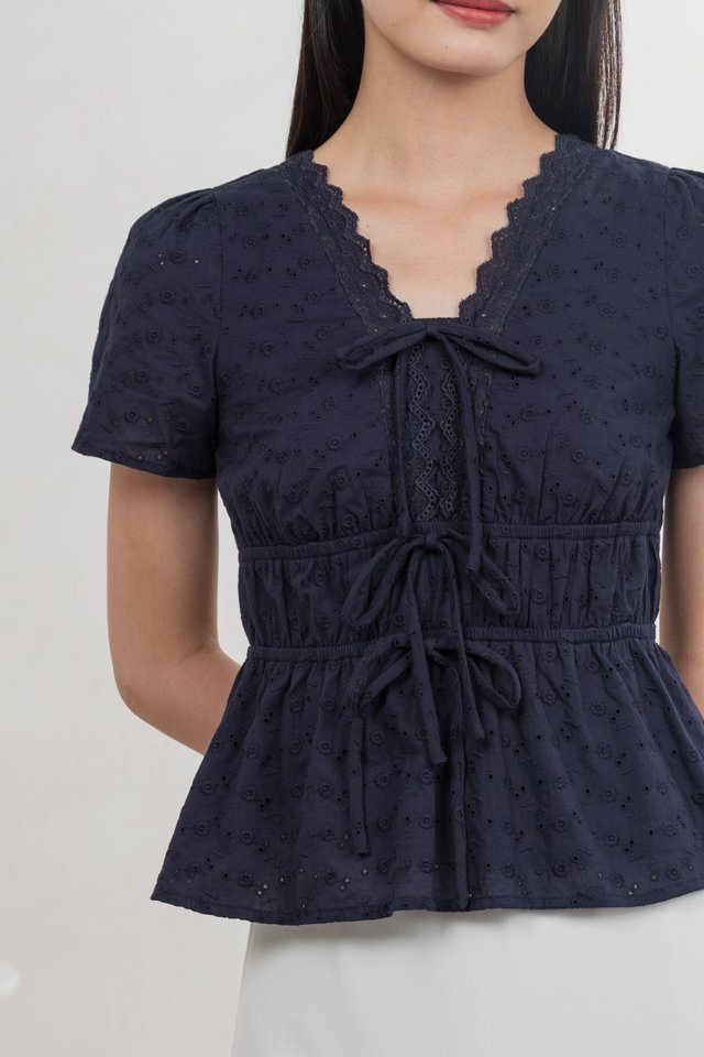 Aviva Eyelet Ribbon Top In Navy