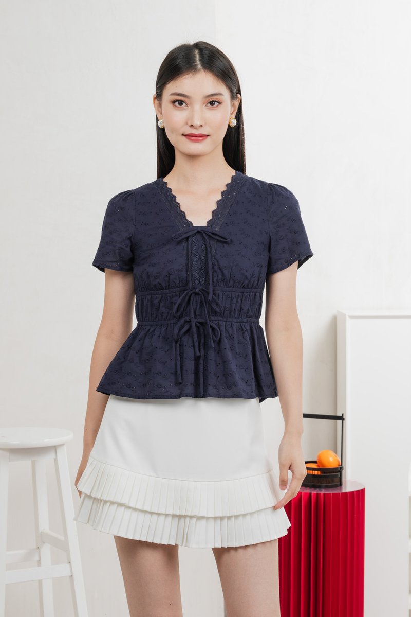 Aviva Eyelet Ribbon Top In Navy
