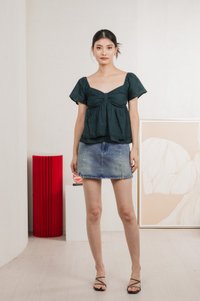 Paola Eyelet Bow Babydoll Top In Emerald
