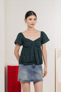 Paola Eyelet Bow Babydoll Top In Emerald