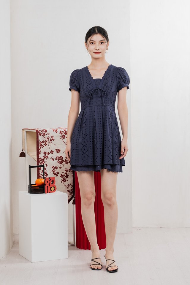 Rosewood Eyelet Ribbon Pleated Dress In Navy