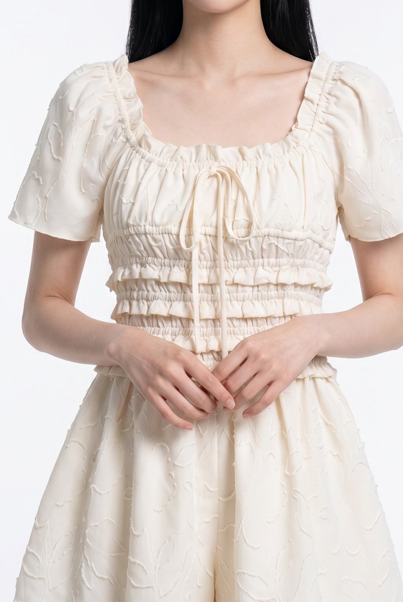 Bryce Smocked Ruffles Romper In Cream
