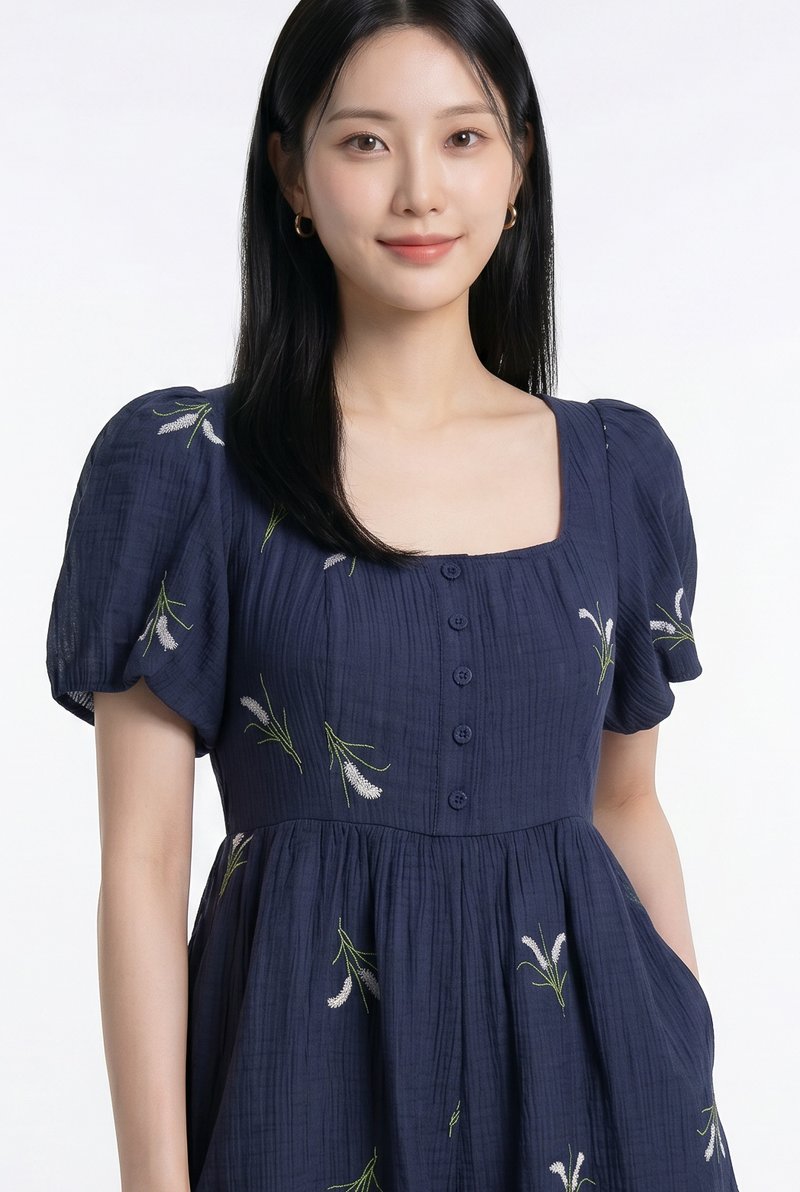 Nia Embroidered Floral Button Romper in Navy