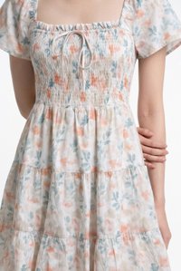 Clarita Smocked Ruffles Tier Dress In Peach