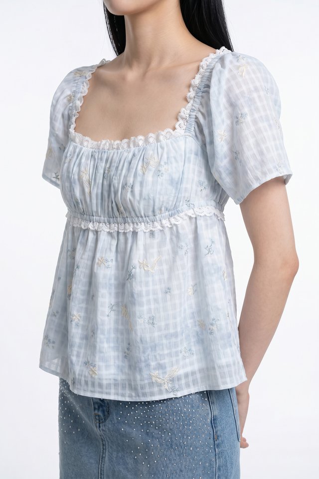 Kalena Ruched Lace Fleur Top In Blue