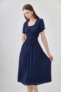 Gabriella Smocked Midi Dress In Navy