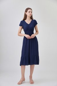Rhea Textured Smocked Waist Midi Dress In Navy