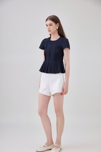 Ainara Pintuck Pleated Peplum Top In Navy