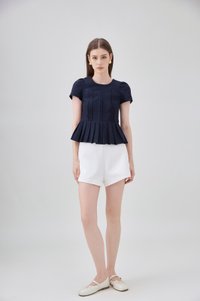 Ainara Pintuck Pleated Peplum Top In Navy