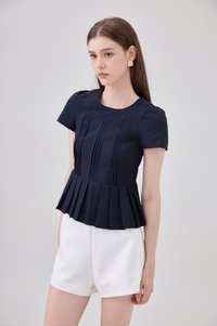 Ainara Pintuck Pleated Peplum Top In Navy