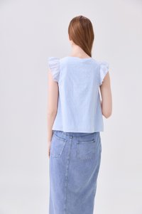 Delaney Swiss Dot Ruffles Top In Powder Blue