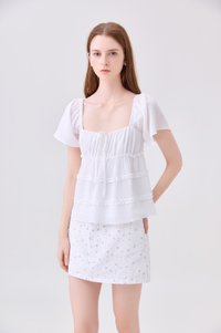 Evelina Textured Ruffles Ribbon Top In White