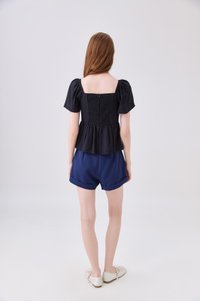 Zaya Textured Ribbon Babydoll Top In Black