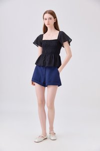 Calista Textured Smocked Top In Black