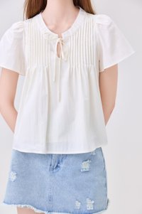 Journee Pintuck Ribbon Top In Cream