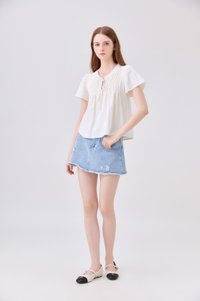 Journee Pintuck Ribbon Top In Cream