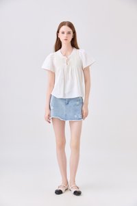 Journee Pintuck Ribbon Top In Cream