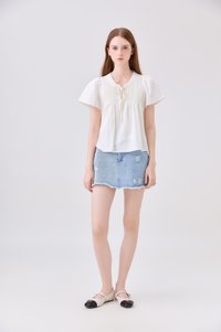 Journee Pintuck Ribbon Top In Cream