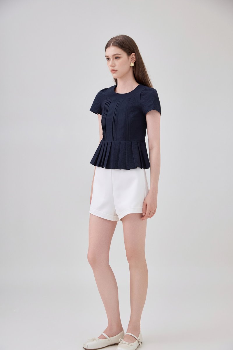Ainara Pintuck Pleated Peplum Top In Navy