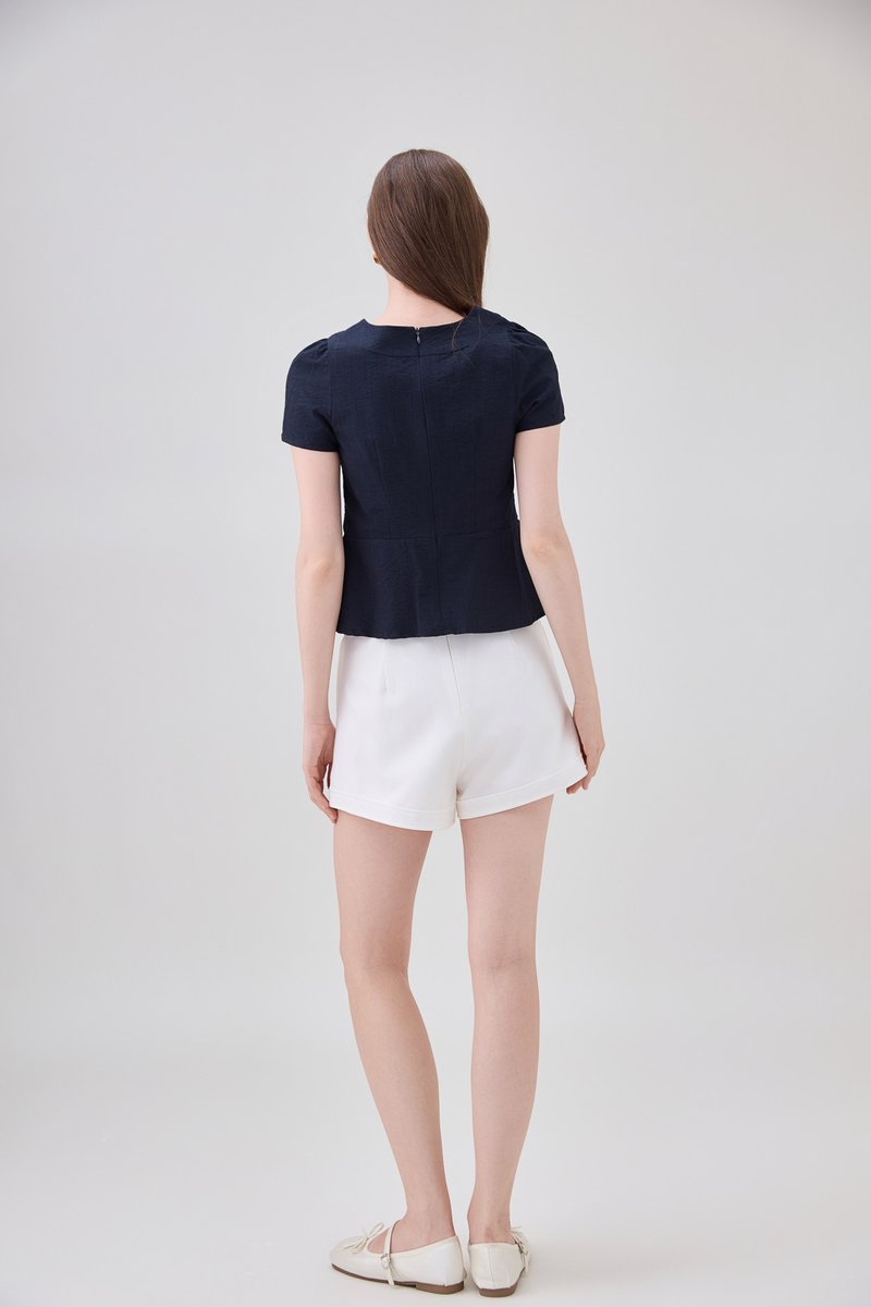 Ainara Pintuck Pleated Peplum Top In Navy