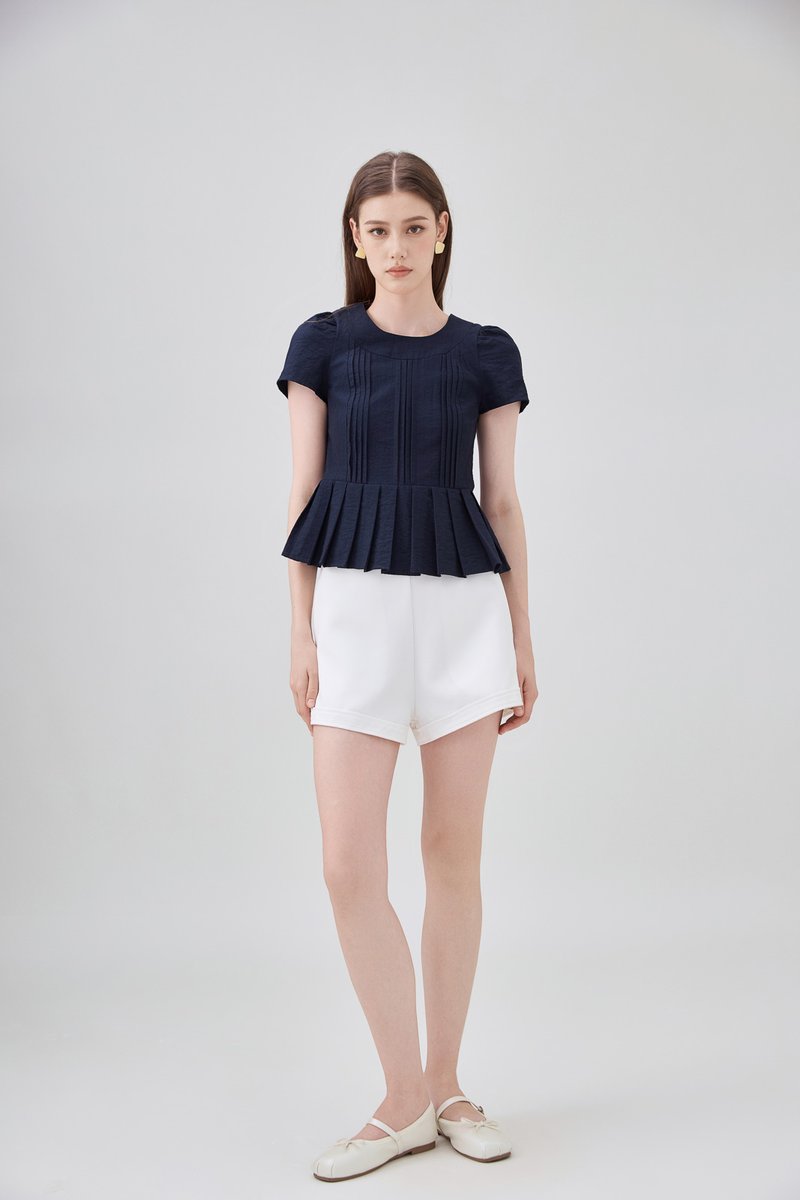 Ainara Pintuck Pleated Peplum Top In Navy