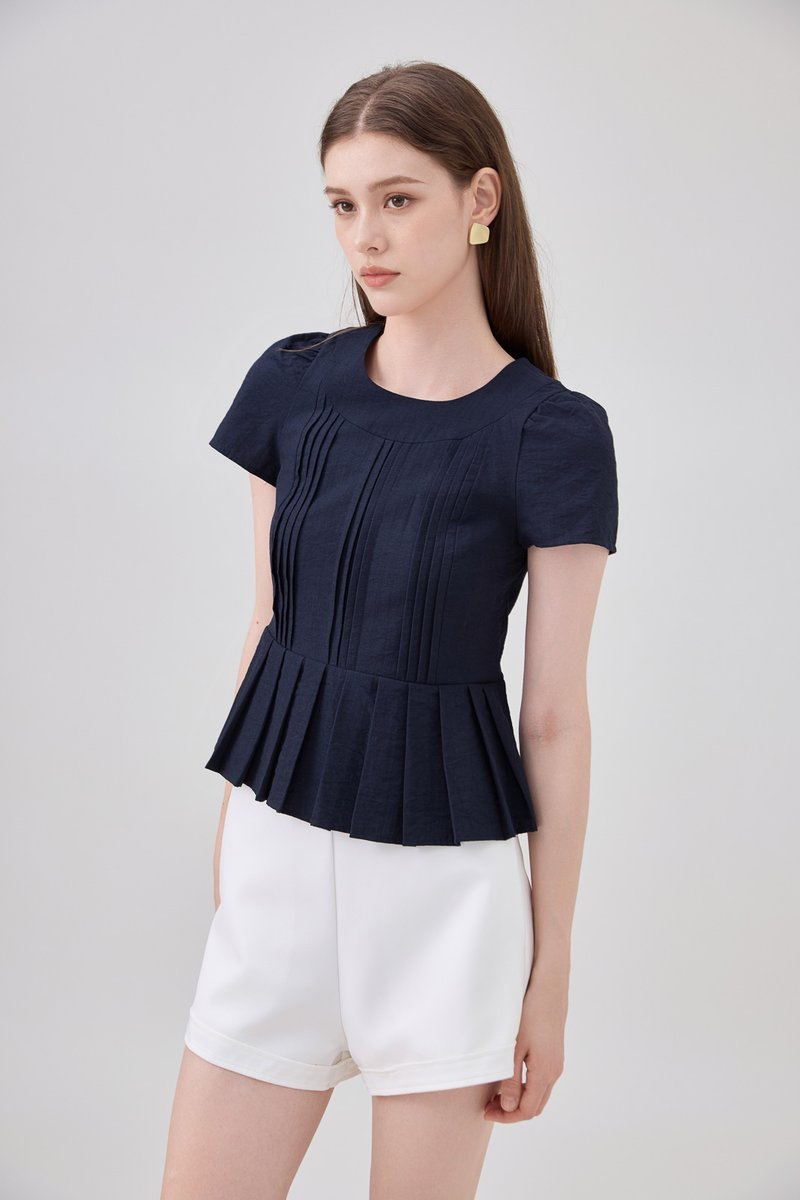 Ainara Pintuck Pleated Peplum Top In Navy