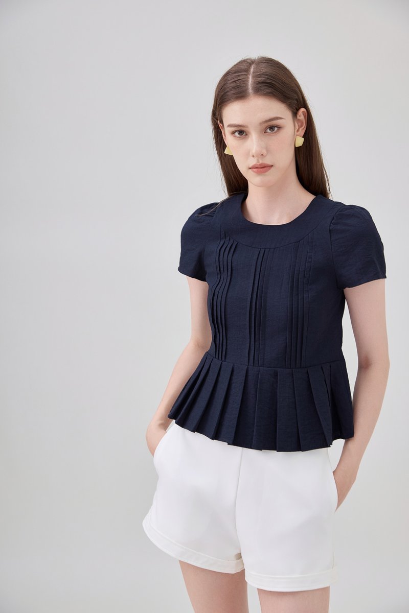 Ainara Pintuck Pleated Peplum Top In Navy