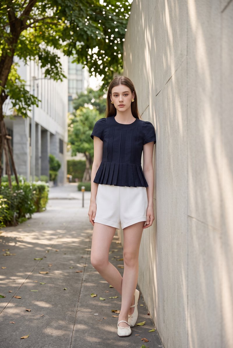 Ainara Pintuck Pleated Peplum Top In Navy
