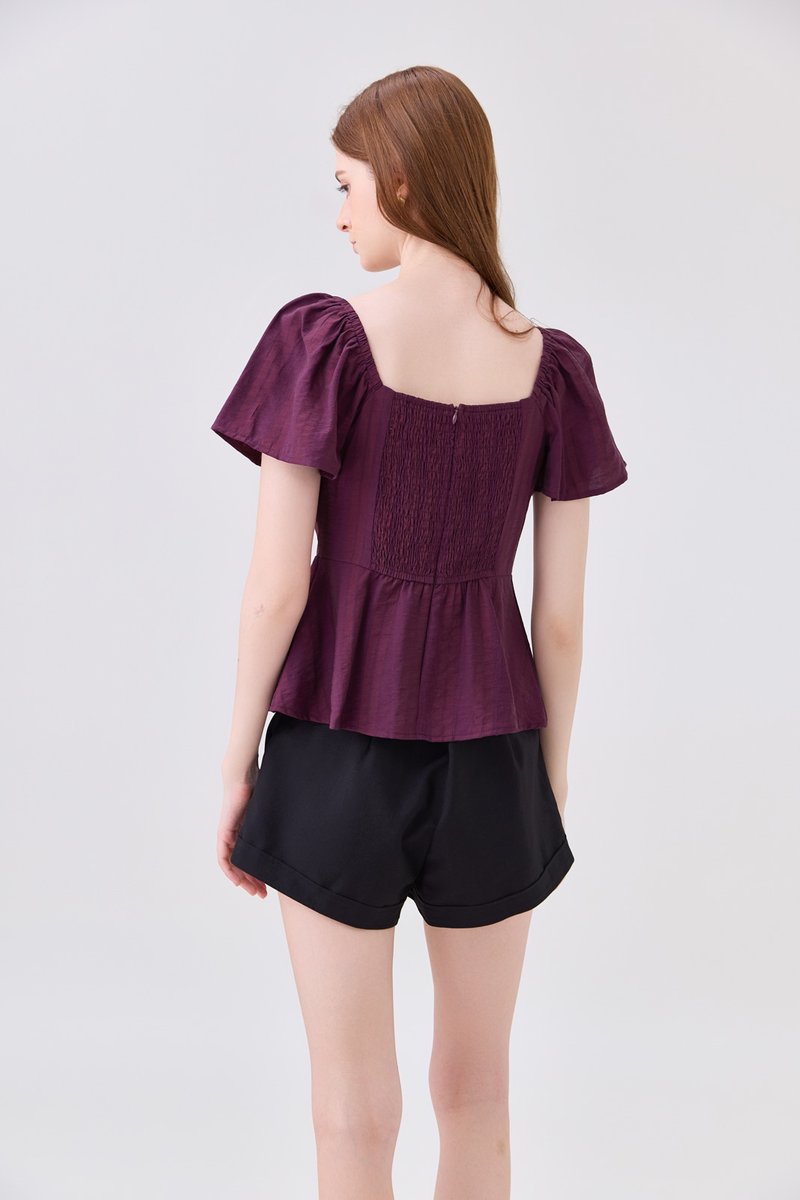 Zelia Peplum Top In Plum