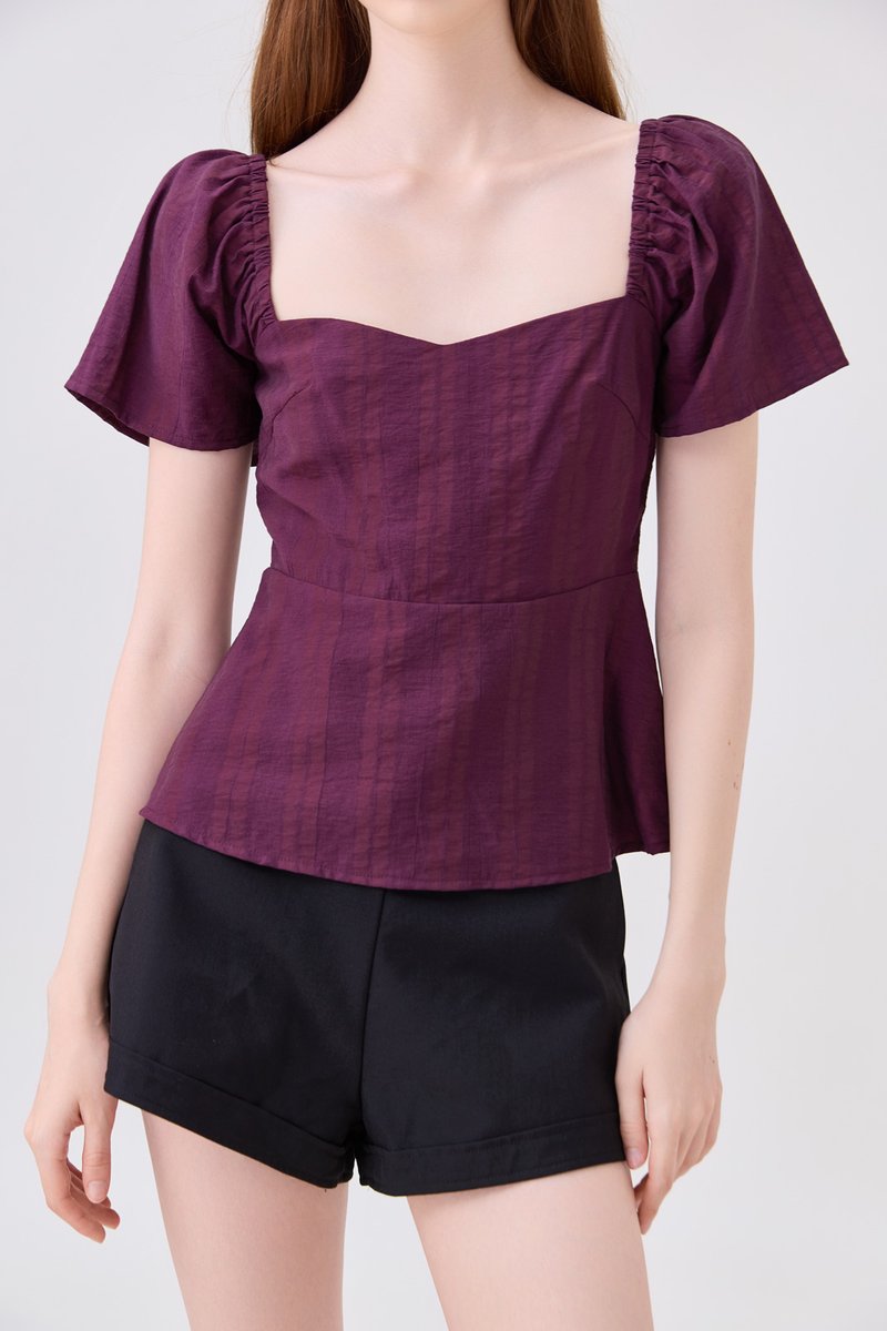 Zelia Peplum Top In Plum