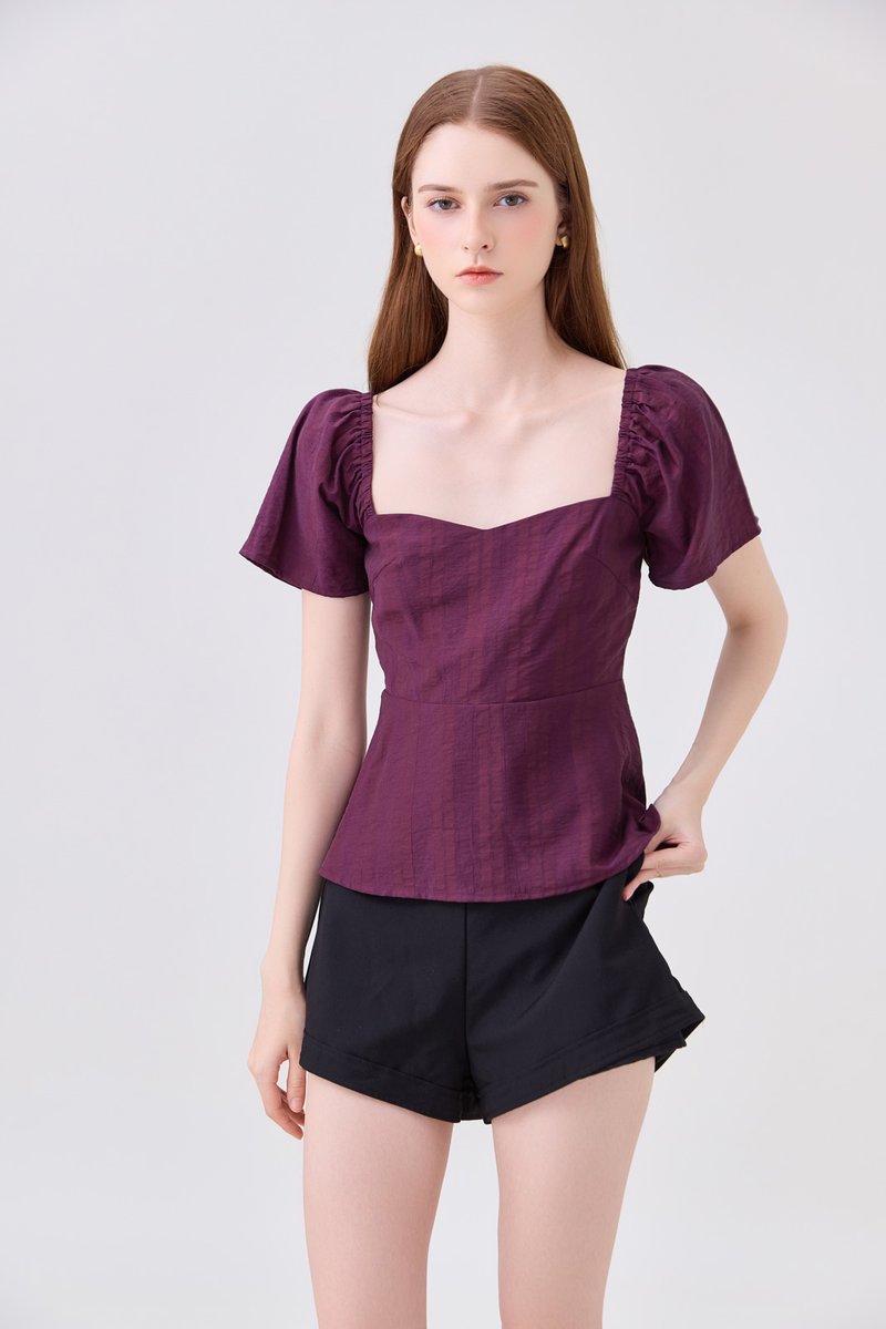 Zelia Peplum Top In Plum