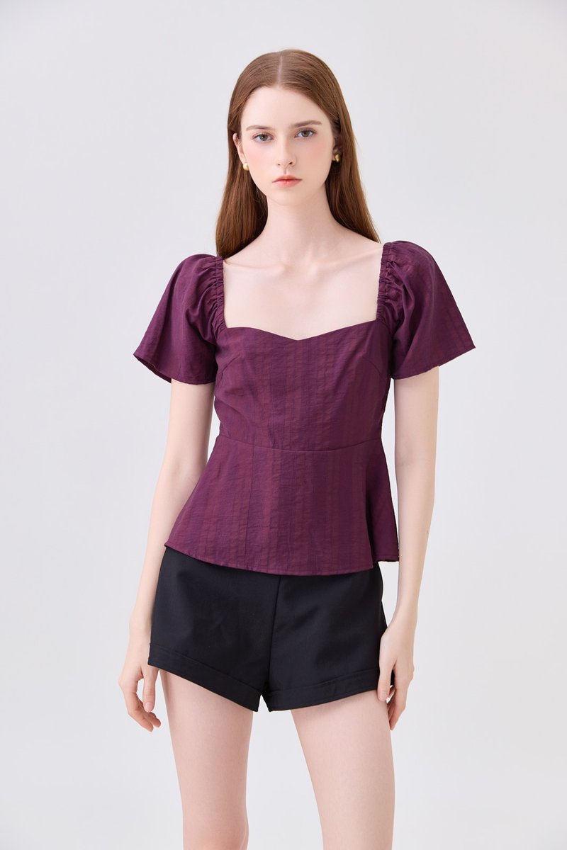Zelia Peplum Top In Plum