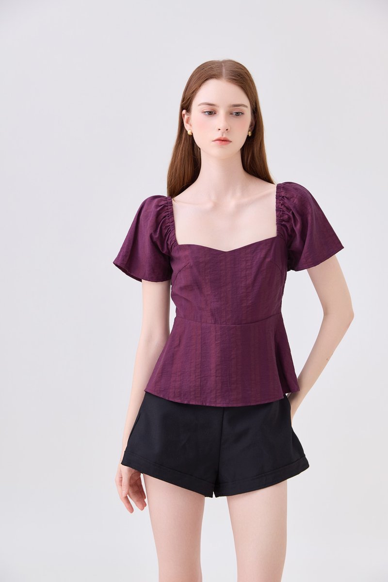 Zelia Peplum Top In Plum