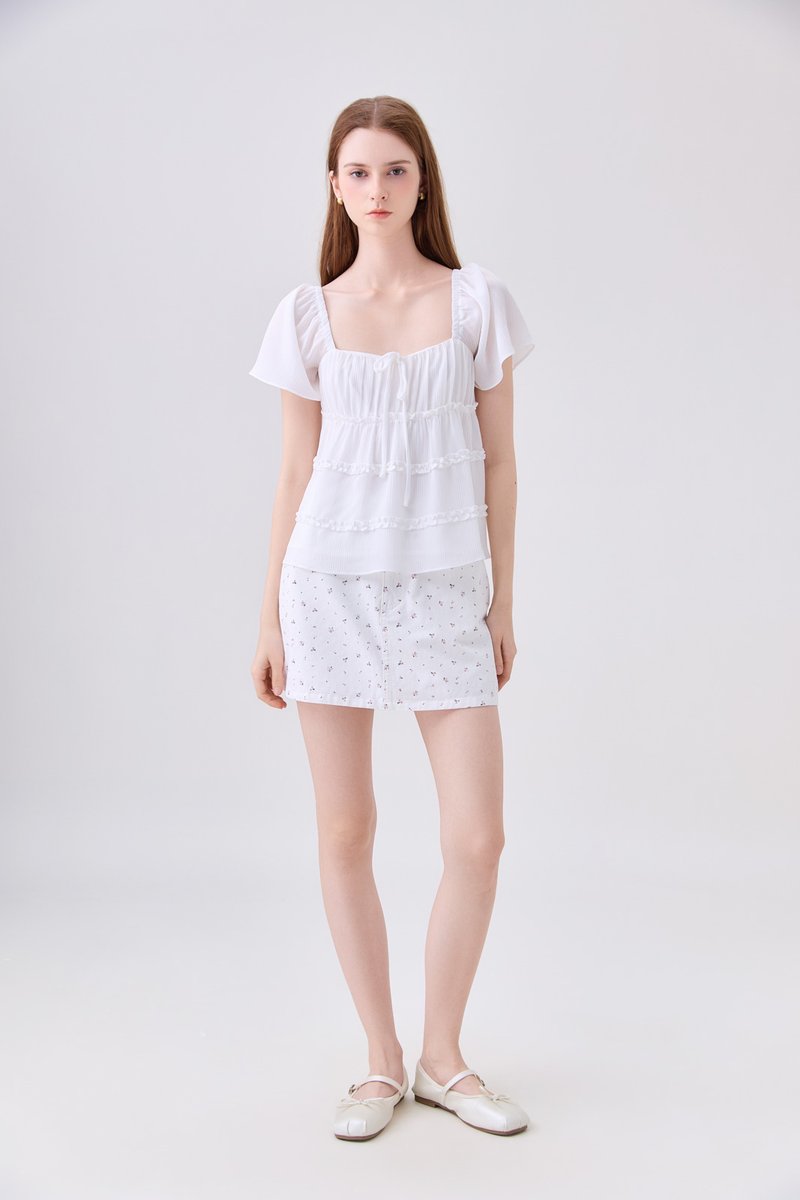 Evelina Textured Ruffles Ribbon Top In White